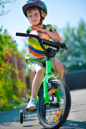 Boy with helmet on bicycle - Spivey Law Firm, Personal Injury Attorneys, P.A.