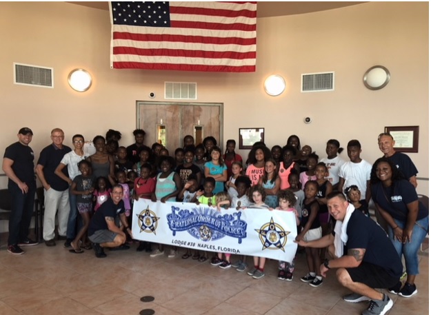 Spivey Law Supports Naples Copy & Kids/Santa with a Badge Program